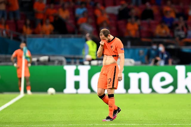 <p>Daley Blind of Netherlands reacts as he leaves the pitch</p>