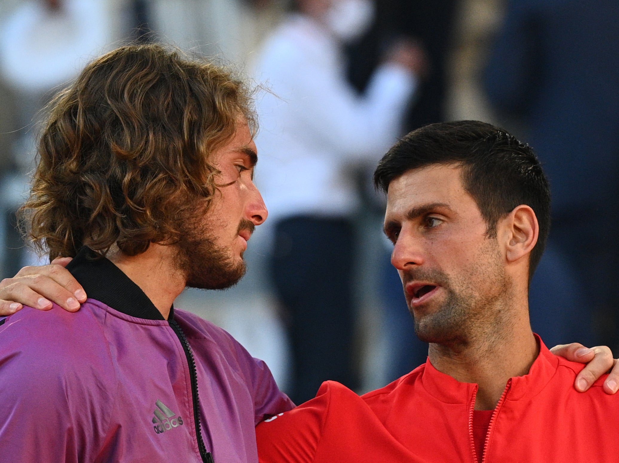 Novak Djokovic (right) consoles Stefanos Tsitsipas after the French Open final