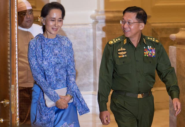 <p>File image: In this file photo taken on 30 March, 2016, Aung San Suu Kyi and Myanmar military chief Senior General Min Aung Hlaing (R) arrive for a handover ceremony at the presidential palace in Naypyidaw</p>