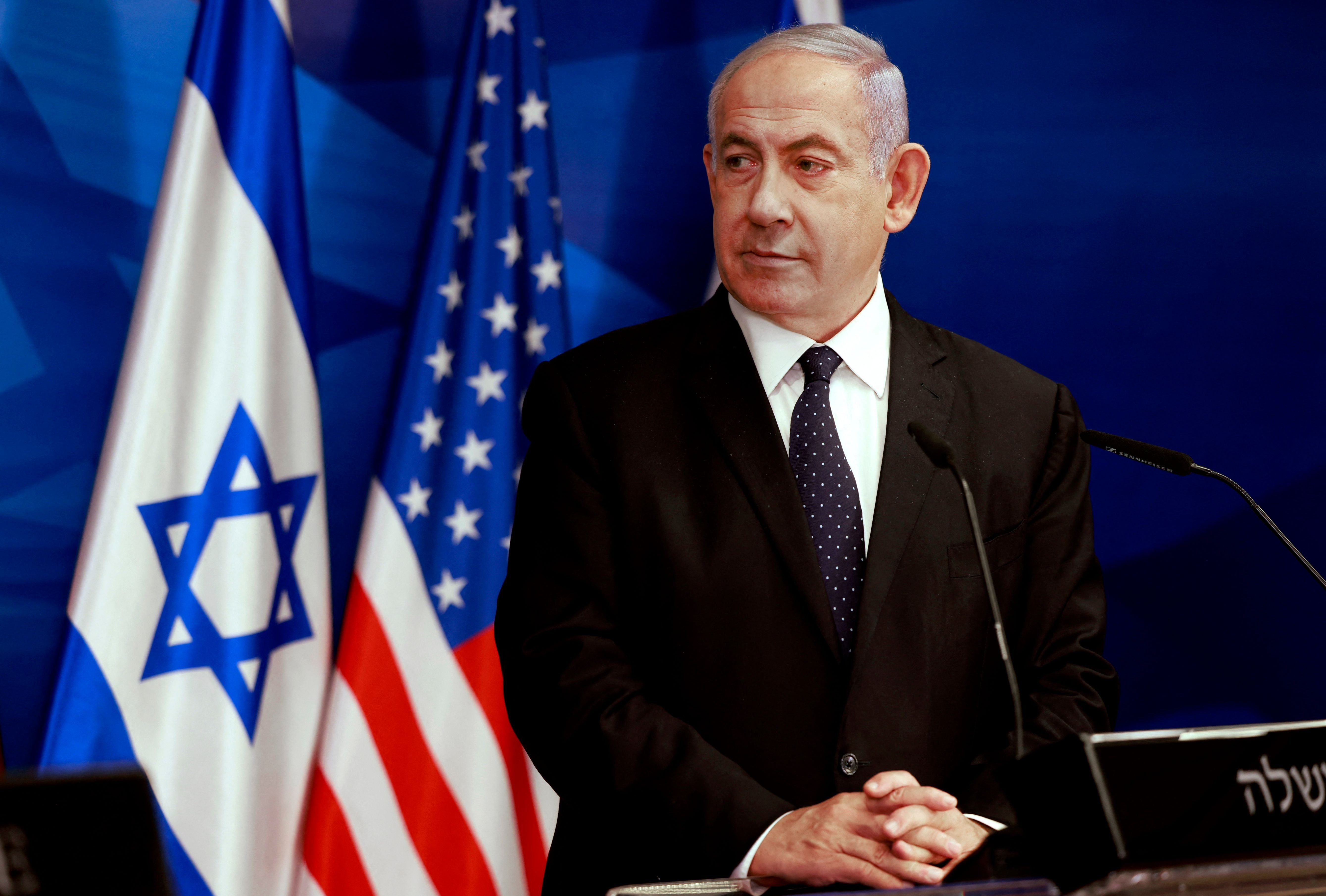 Benjamin Netanyahu watches US Secretary of State Anthony Blinken during a joint press conference in Jerusalem after an Egypt-brokered truce halted fighting