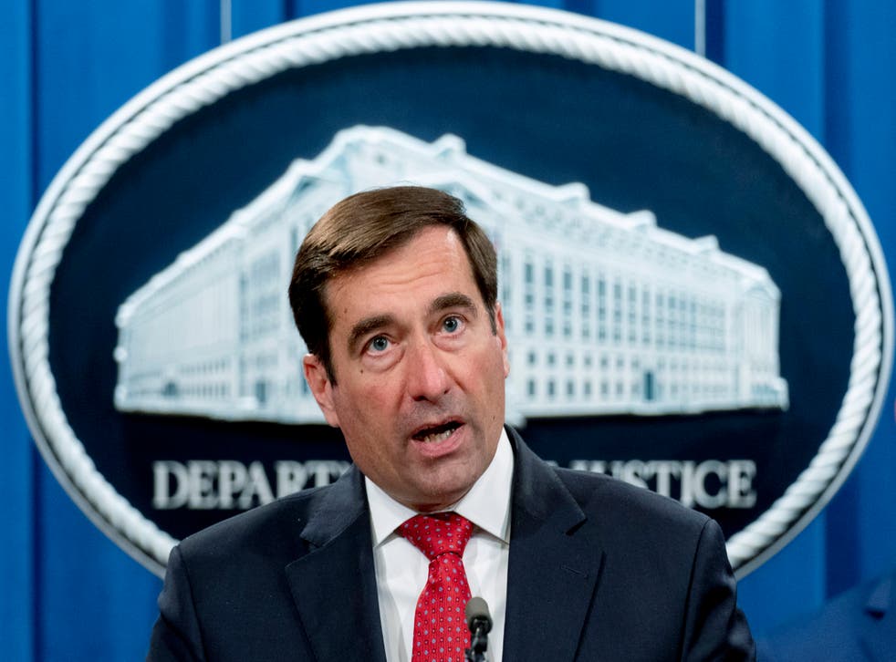 <p>John Demers gives a press briefing at the Justice Department</p>