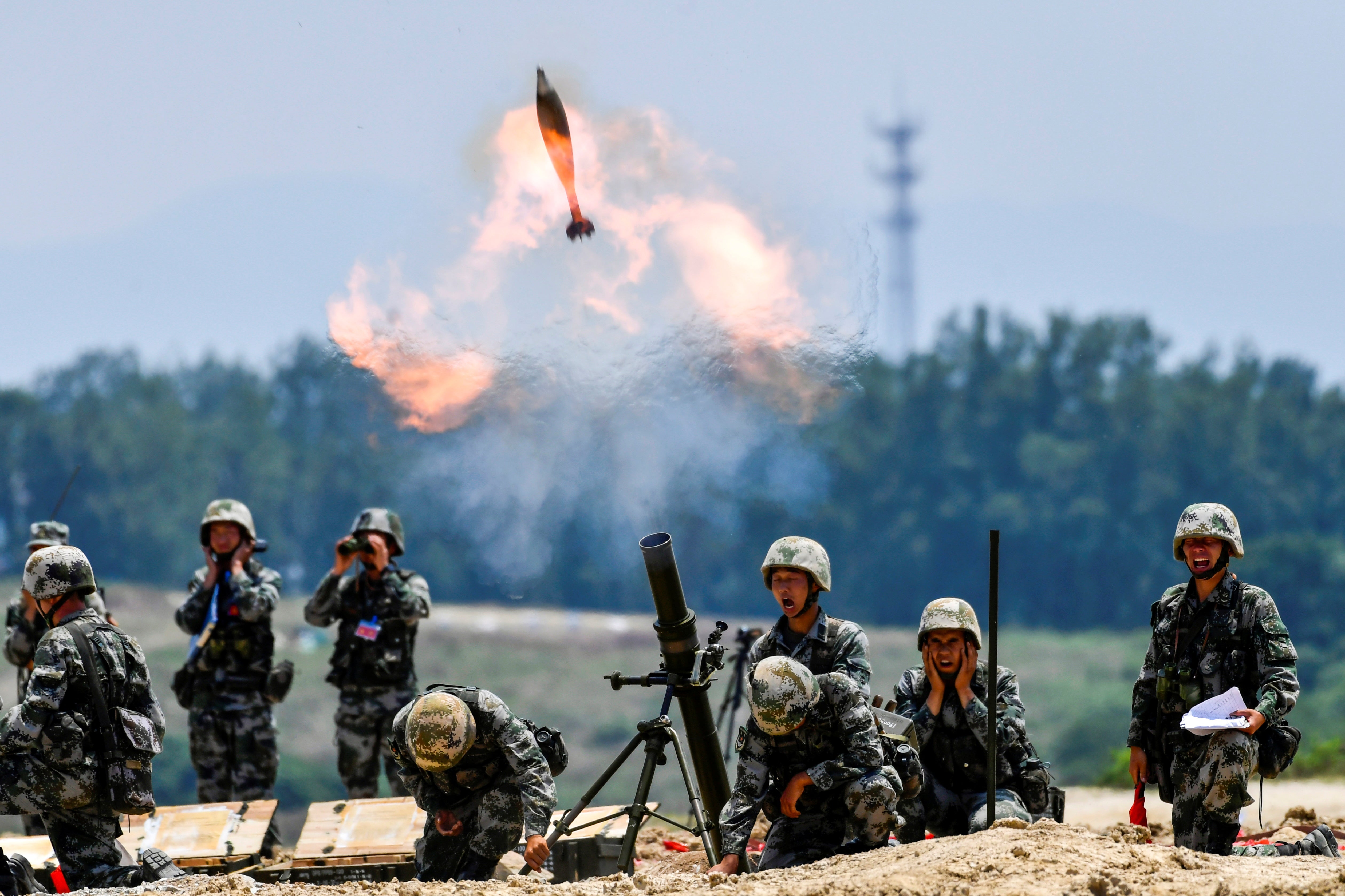 Soldiers of the Chinese People’s Liberation Army fire a mortar during a live-fire military exercise last month