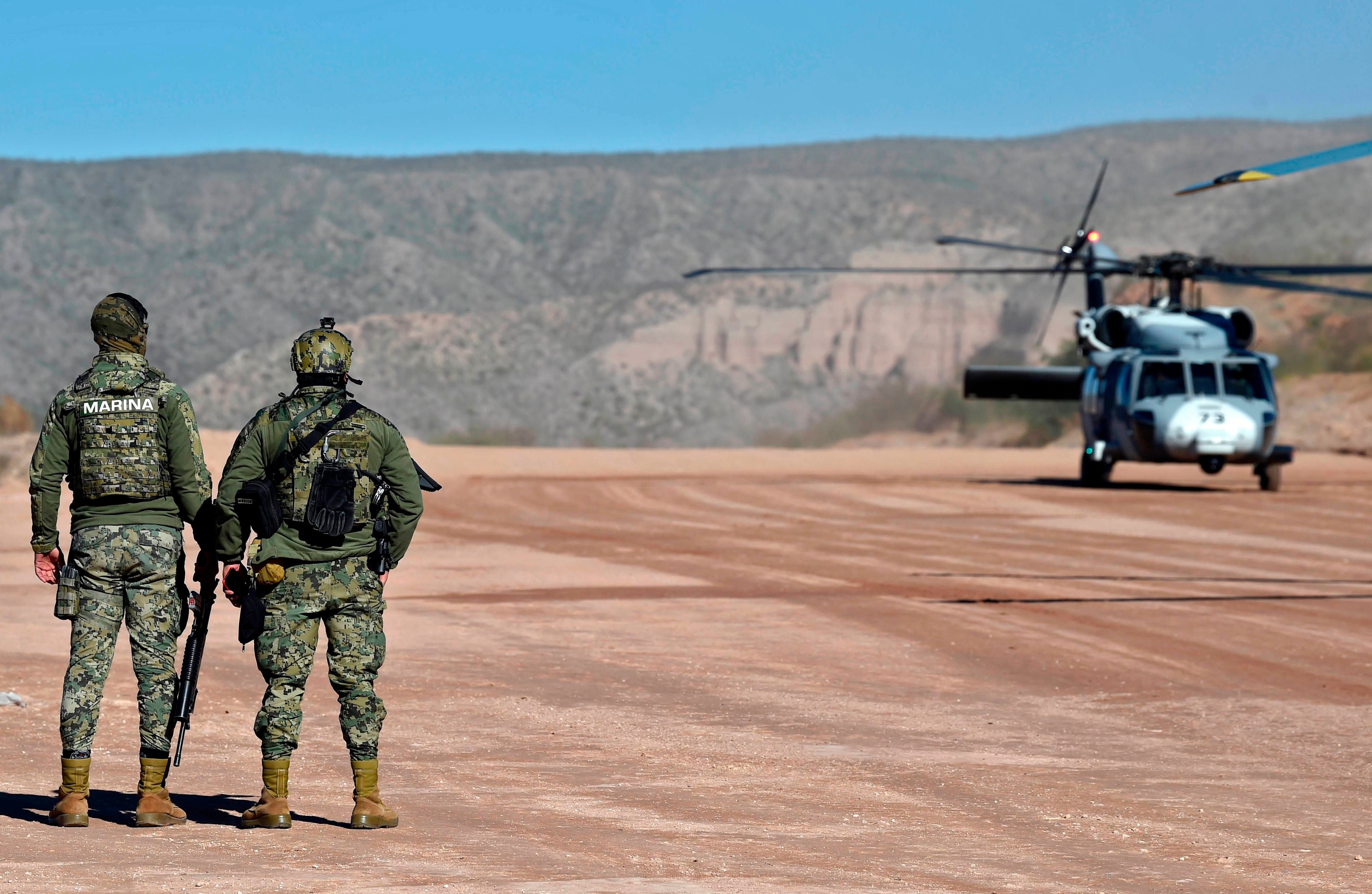 Members of the Mexican Navy are seen upon the landing of an Air Force helicopter at La Mora ranch, in Bavispe, Sonora state, Mexico, on January 11, 2020.
