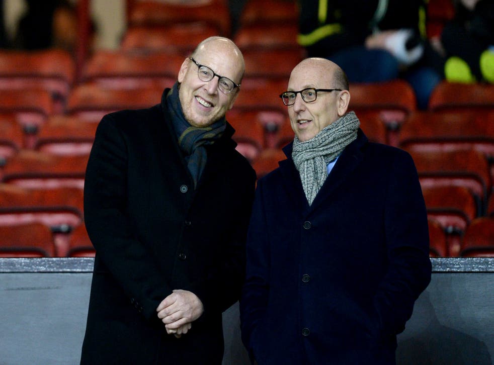 Joel Glazer (right) admits Manchester United's owners need to engage more with fans