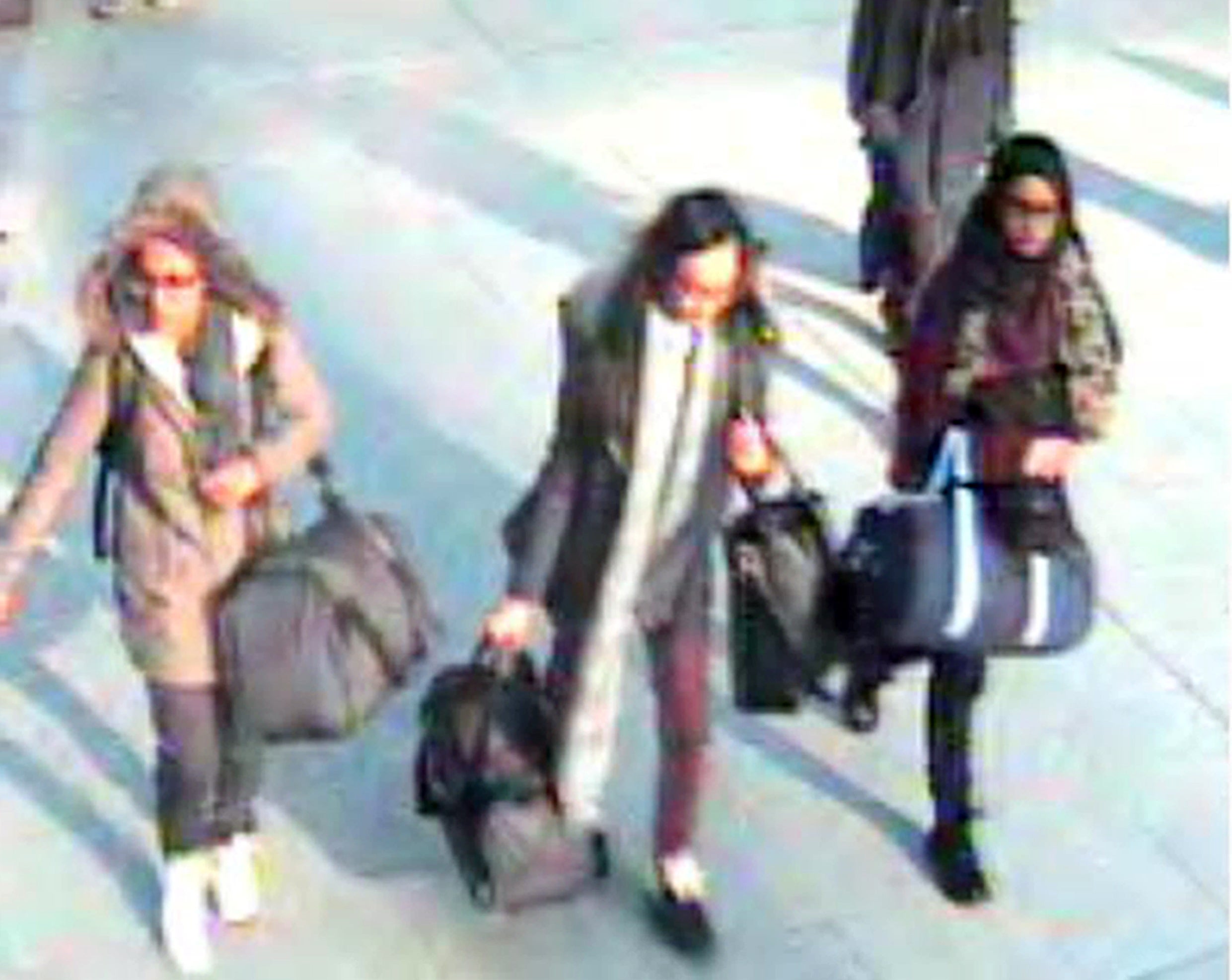 15-year-old Amira Abase, Kadiza Sultana, 16, and Shamima Begum, 15, at Gatwick airport on their way to Syria in February 2015