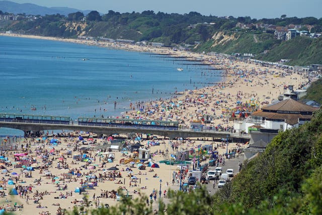 <p>Monday marked the hottest day of the year, with temperatures soaring to 29.7C and crowds flocking to beaches across the UK</p>