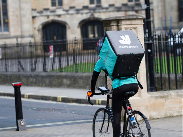 <p>A Deliveroo rider on a bicycle</p>