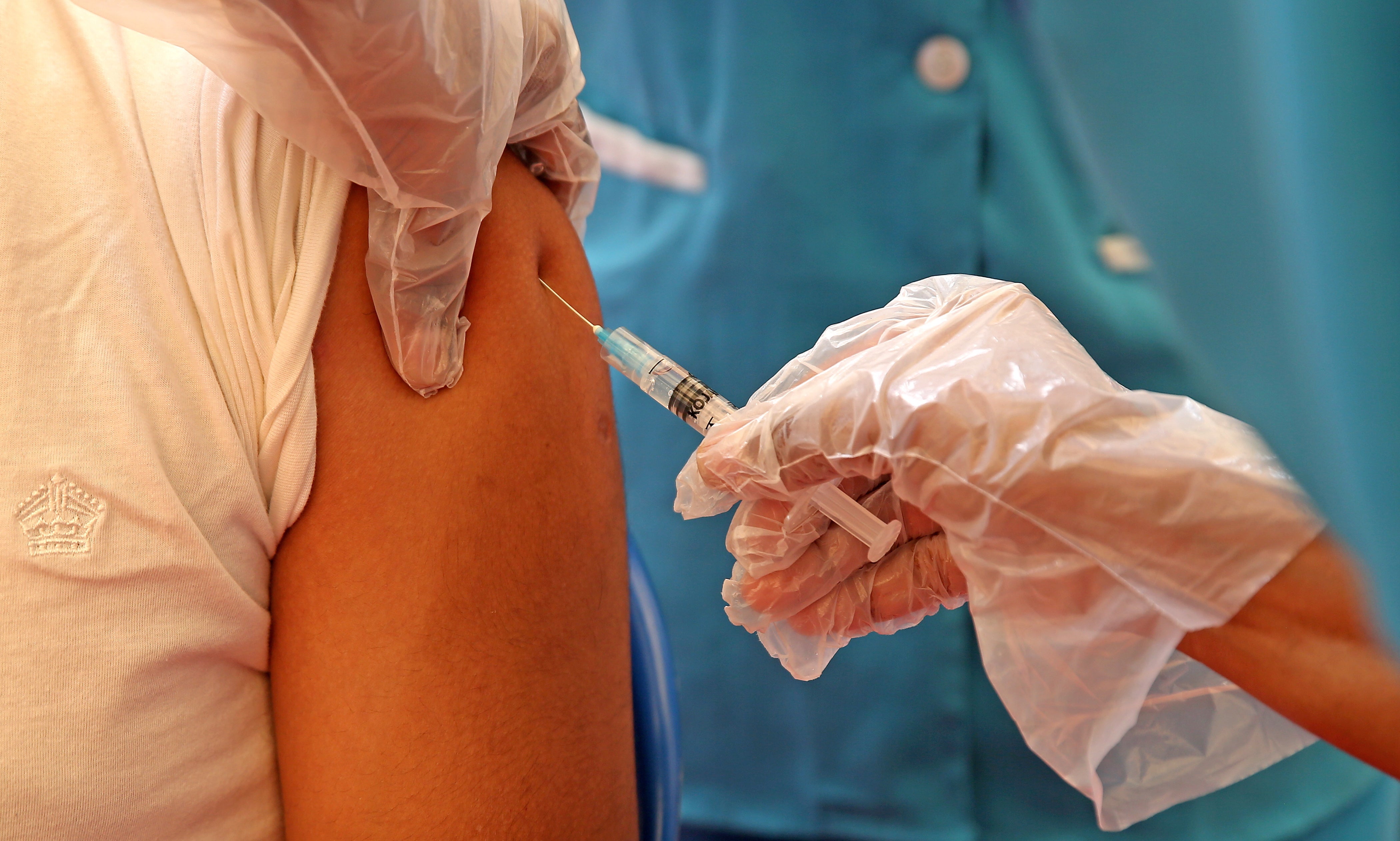 A man receives a shot of a Covid-19 vaccine during an inoculation drive in Bengaluru, India, on 10 June, 2021.