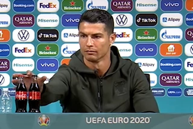 <p>Cristiano Ronaldo removed bottles of Coca-Cola from sight during his press conference</p>