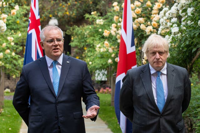 <p>Boris Johnson looks on as Australia’s Prime Minister Scott Morrison speaks at No 10 on Tuesday</p>