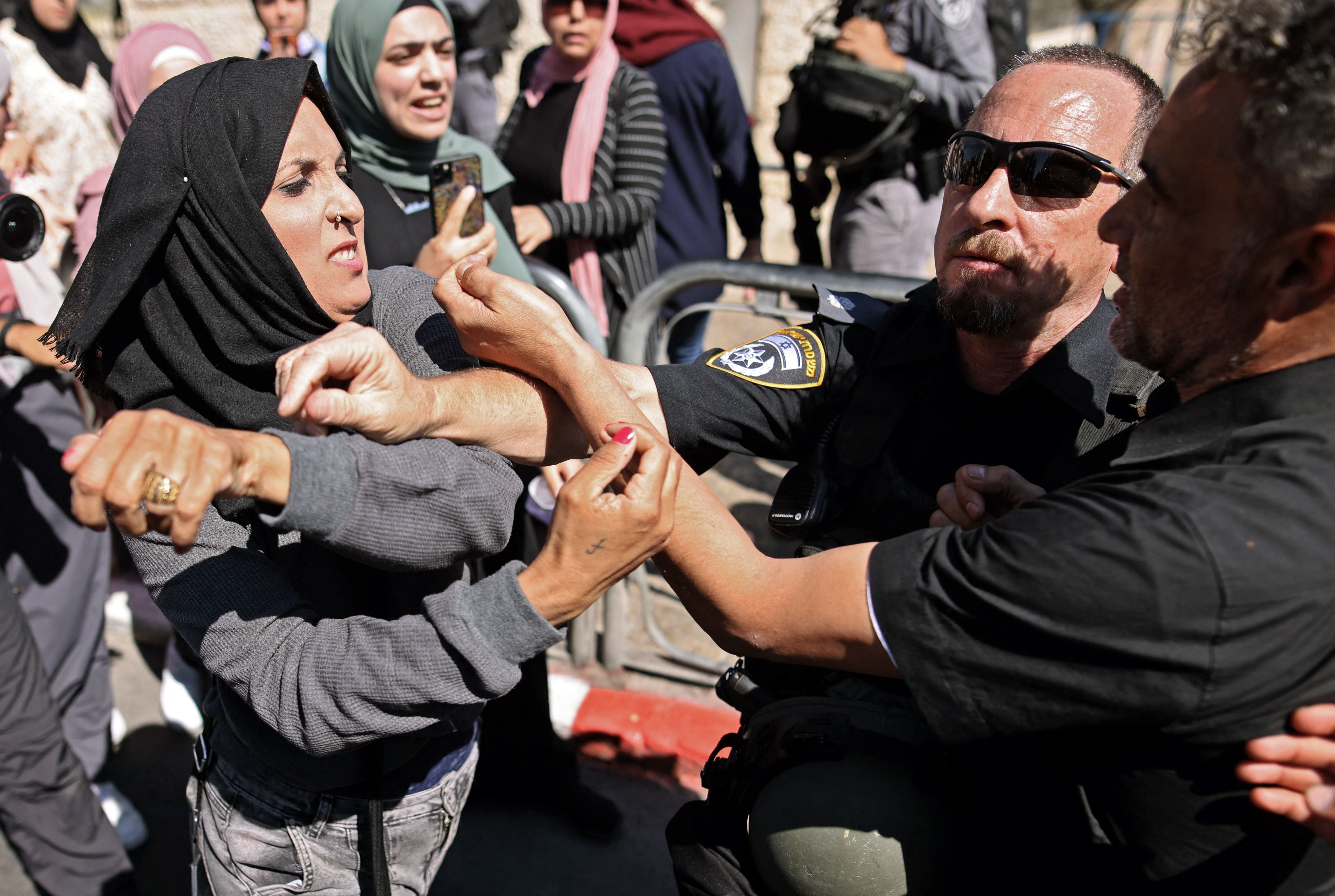 A Palestinian woman confronts Israeli security forces outside the Damascus gate in east Jerusalem