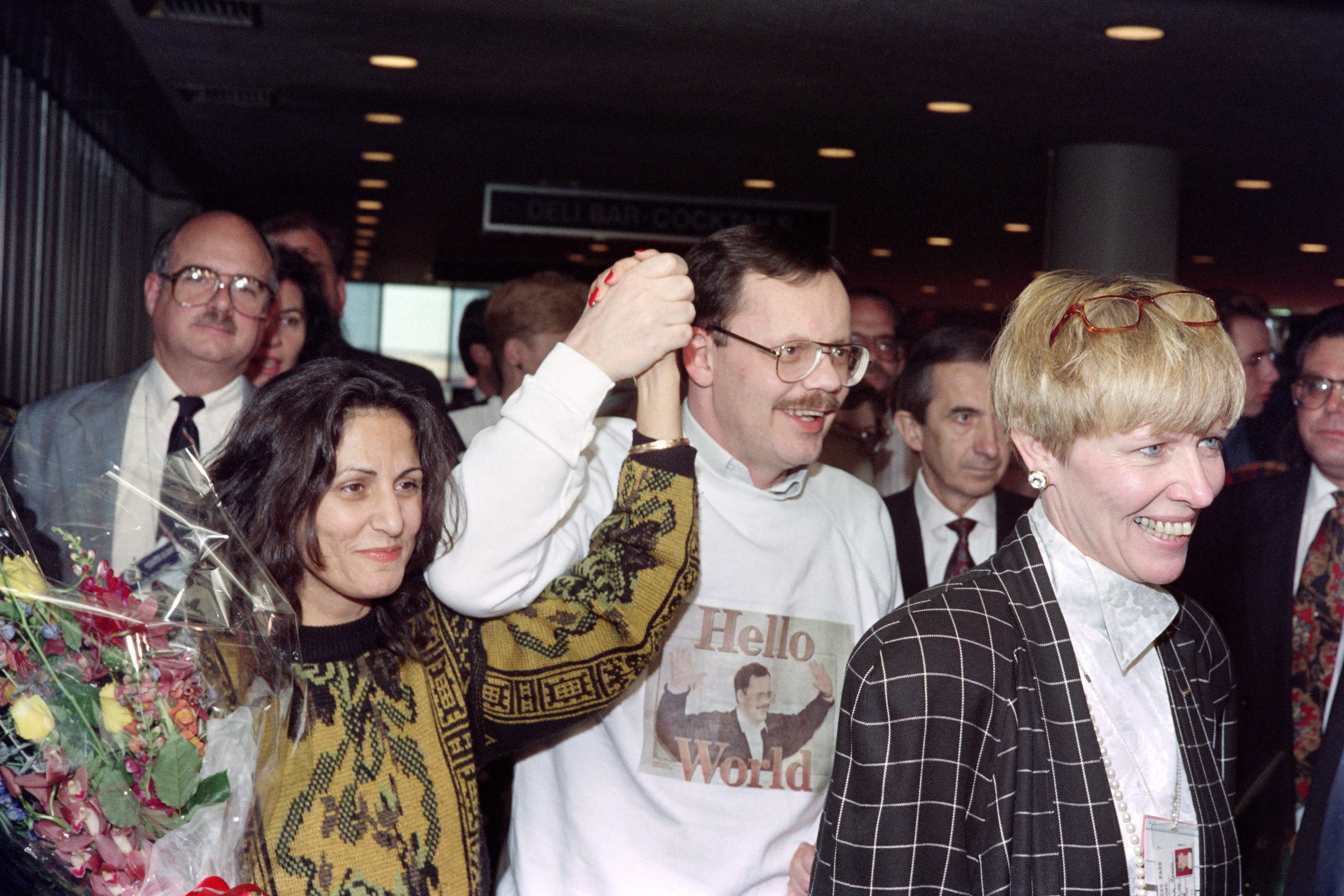 Former US hostage Terry Anderson and his fiancée Madeleine Bassil arrive at John F Kennedy Airport on 10 December 1991