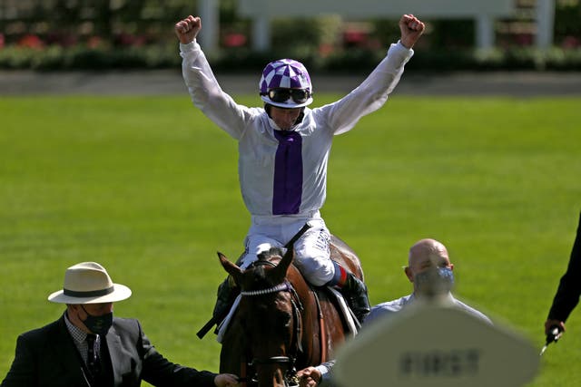 Jockey Kevin Manning celebrates Poetic Flare's breath-taking victory in the St James’s Palace Stakes at Royal Ascot
