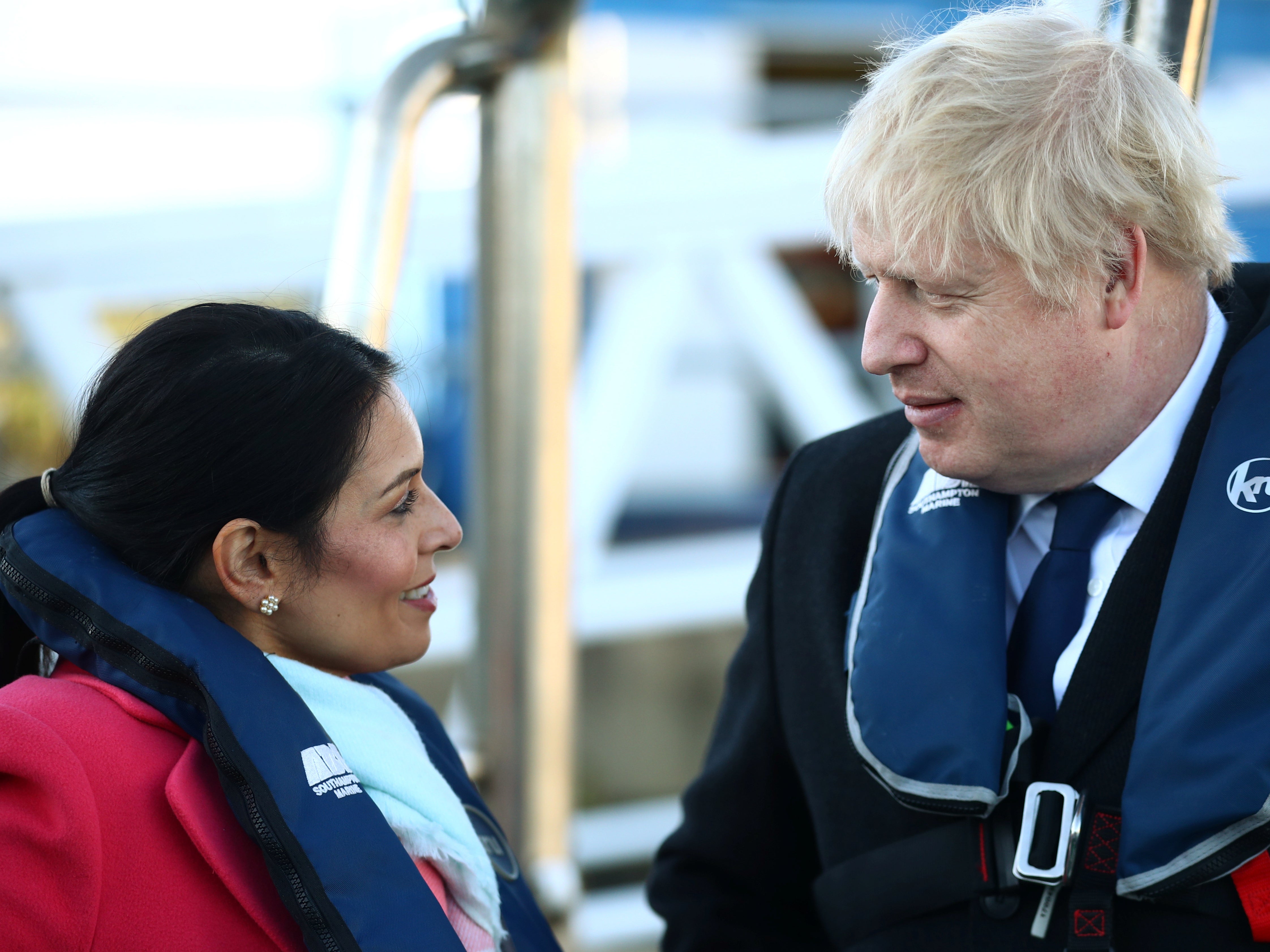 Prime minister Boris Johnson and the home secretary Priti Patel aboard a security vessel at the Port of Southampton