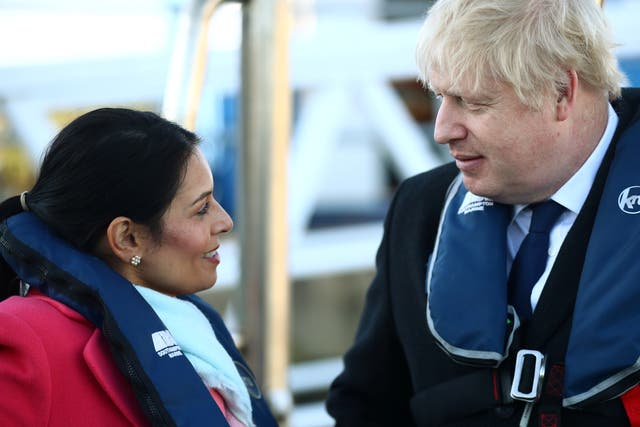 <p>Prime minister Boris Johnson and the home secretary Priti Patel aboard a security vessel at the Port of Southampton</p>