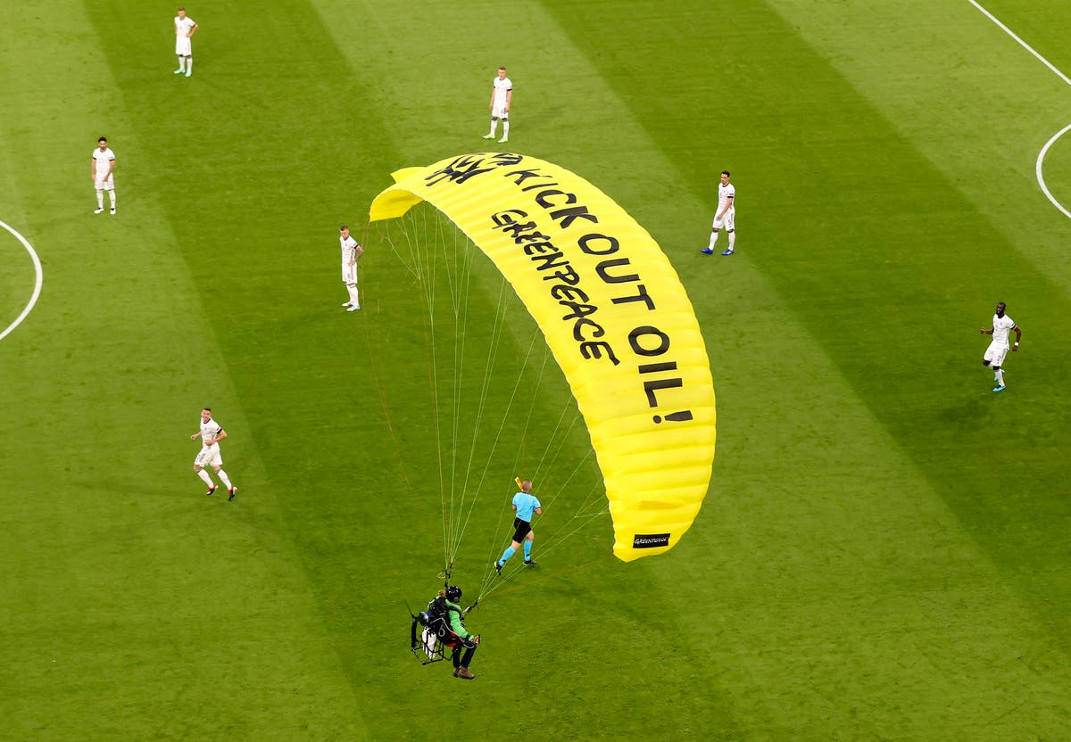Greenpeace protestor parachutes into stadium at Euro 2020 ...