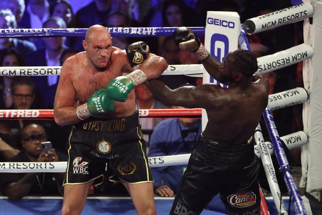 <p>Tyson Fury (left) and Deontay Wilder during their WBC world heavyweight title bout in Las Vegas</p>