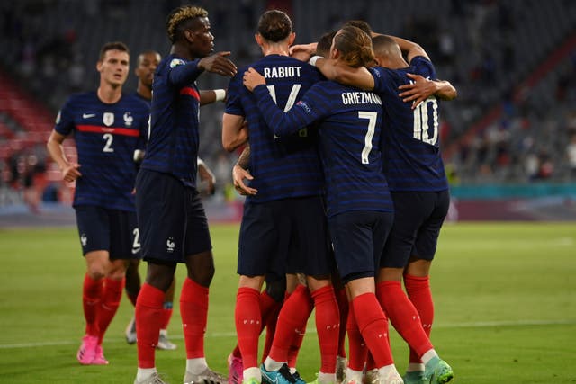 French players celebrate after scoring their side’s first goal during the Euro 2020 Group F match against France and Germany in Munich