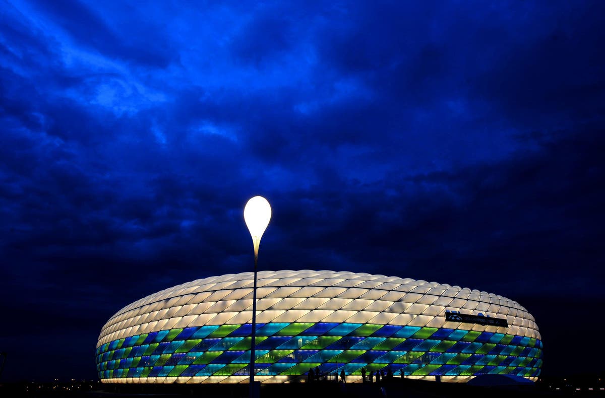 Several injured as Greenpeace protestor parachutes into Germany-France match