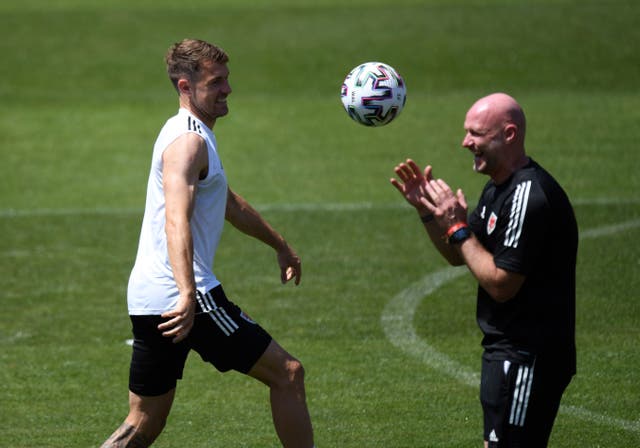Aaron Ramey (left) with Wales interim manager Robert Page during a training session in Baku