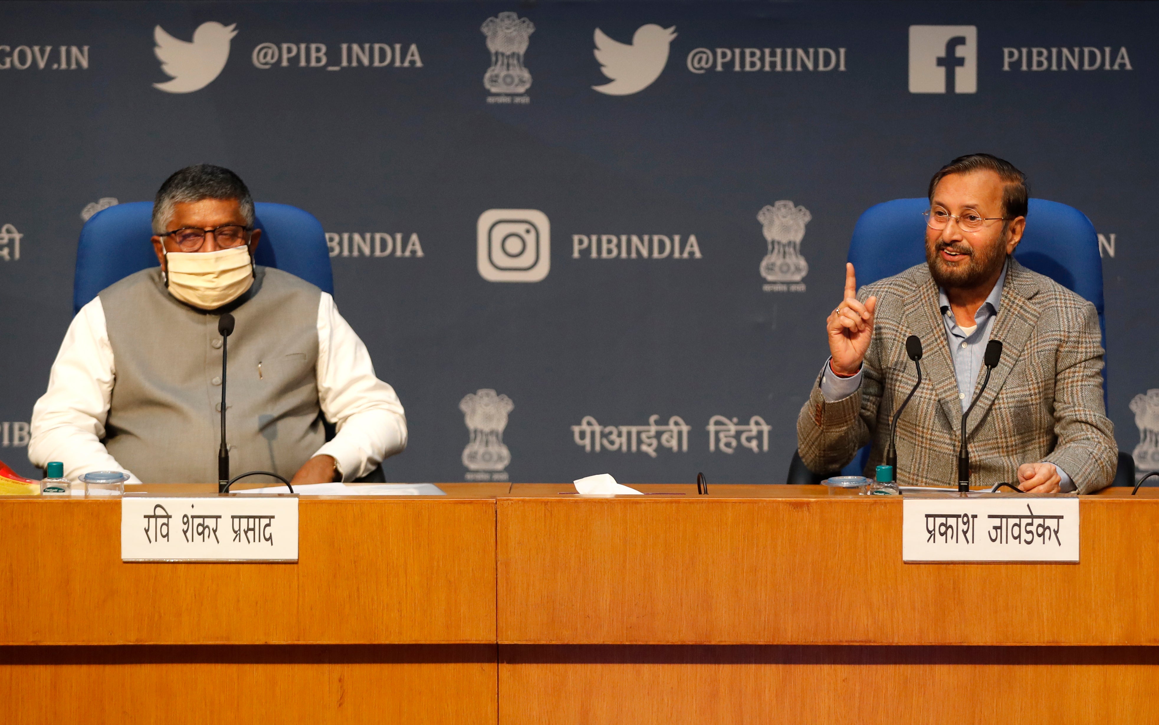 <p>File image: India's IT Minister Ravi Shankar Prasad, left, and Information and Broadcasting Minister Prakash Javadekar address a press conference announcing new regulations for social media companies in February</p>