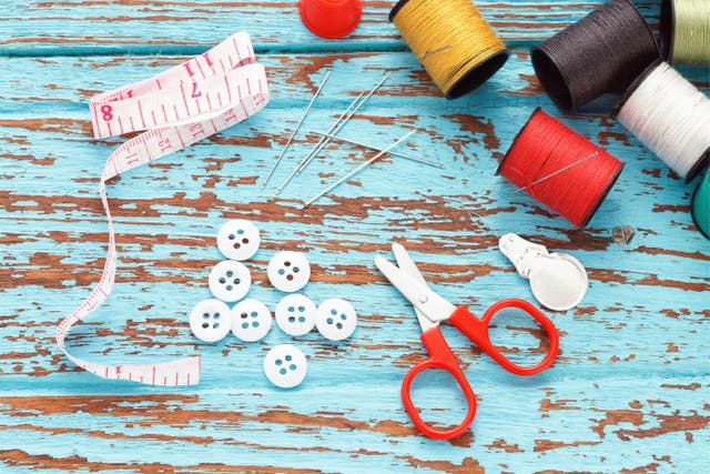 Scissors and sewing supplies laid out on a table
