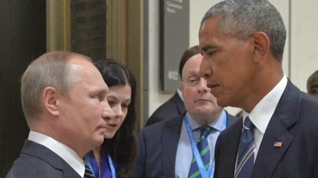<p>Who blinks first? Presidents Putin and Obama stare at each other in a meeting in China</p>