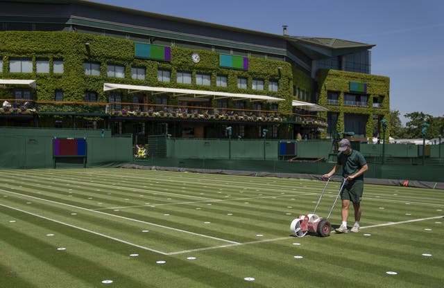 <p>Lines are painted on the outside courts at Wimbledon</p>