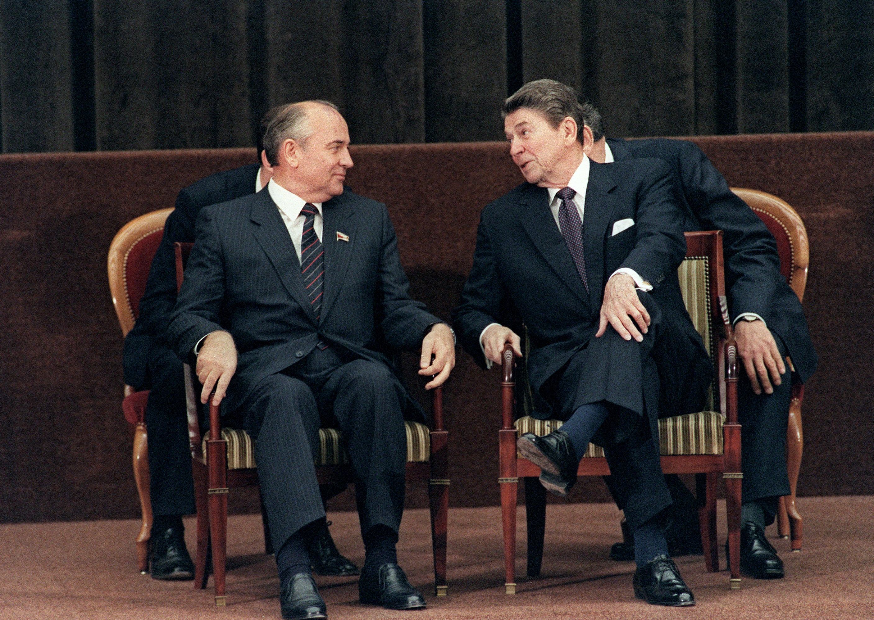 US President Ronald Reagan talks to Soviet general secretary of the Communist Party of the Soviet Union Mikhail Gorbachev