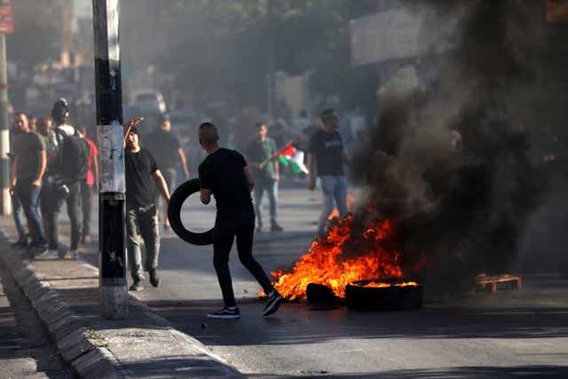 <p>Palestinian protesters clash with Israeli troops in Bethlehem on Tuesday</p>