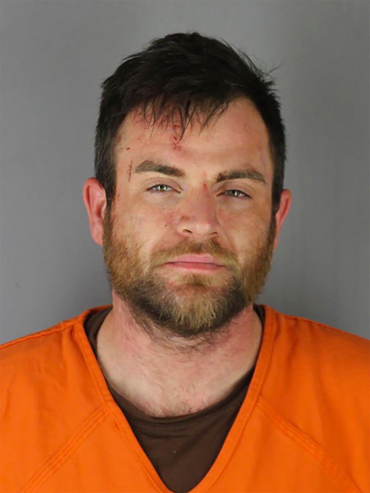 Man who drove at Minneapolis protesters charged with murder