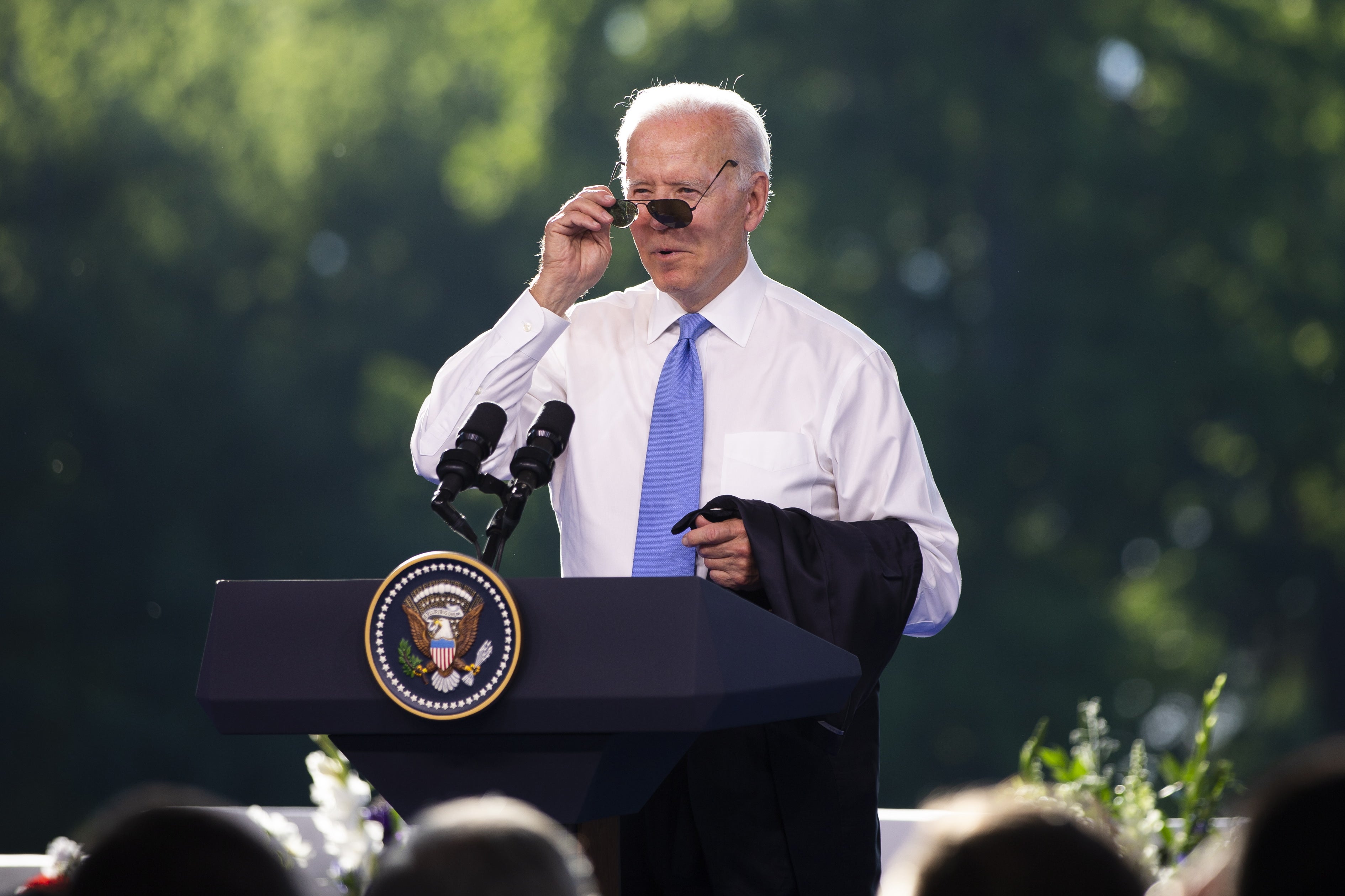 President Biden puts on his sunglasses at the end of the press conference