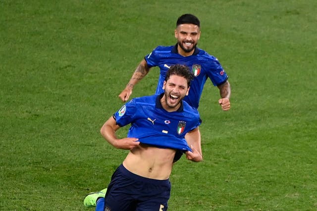 <p>Manuel Locatelli celebrates scoring for Italy</p>