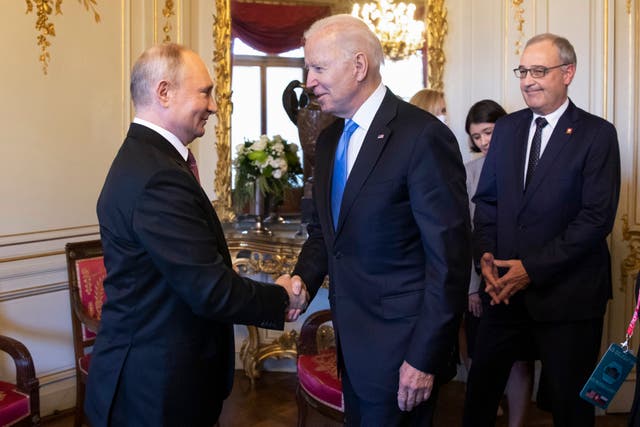 <p>Vladimir Putin shakes hands with Joe Biden during their  summit in Geneva</p>