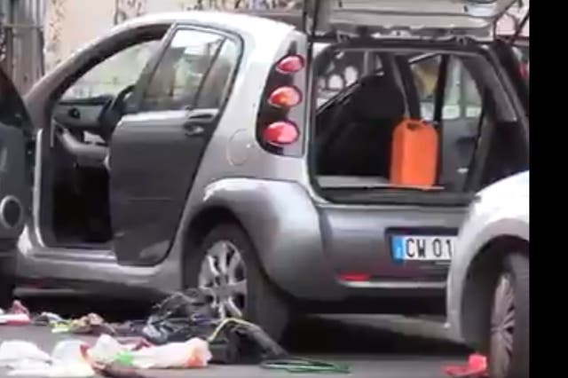 <p>A still from the video of Italian security officials conducting operations to defuse the suspected bomb found near Olympic Stadium, Rome</p>