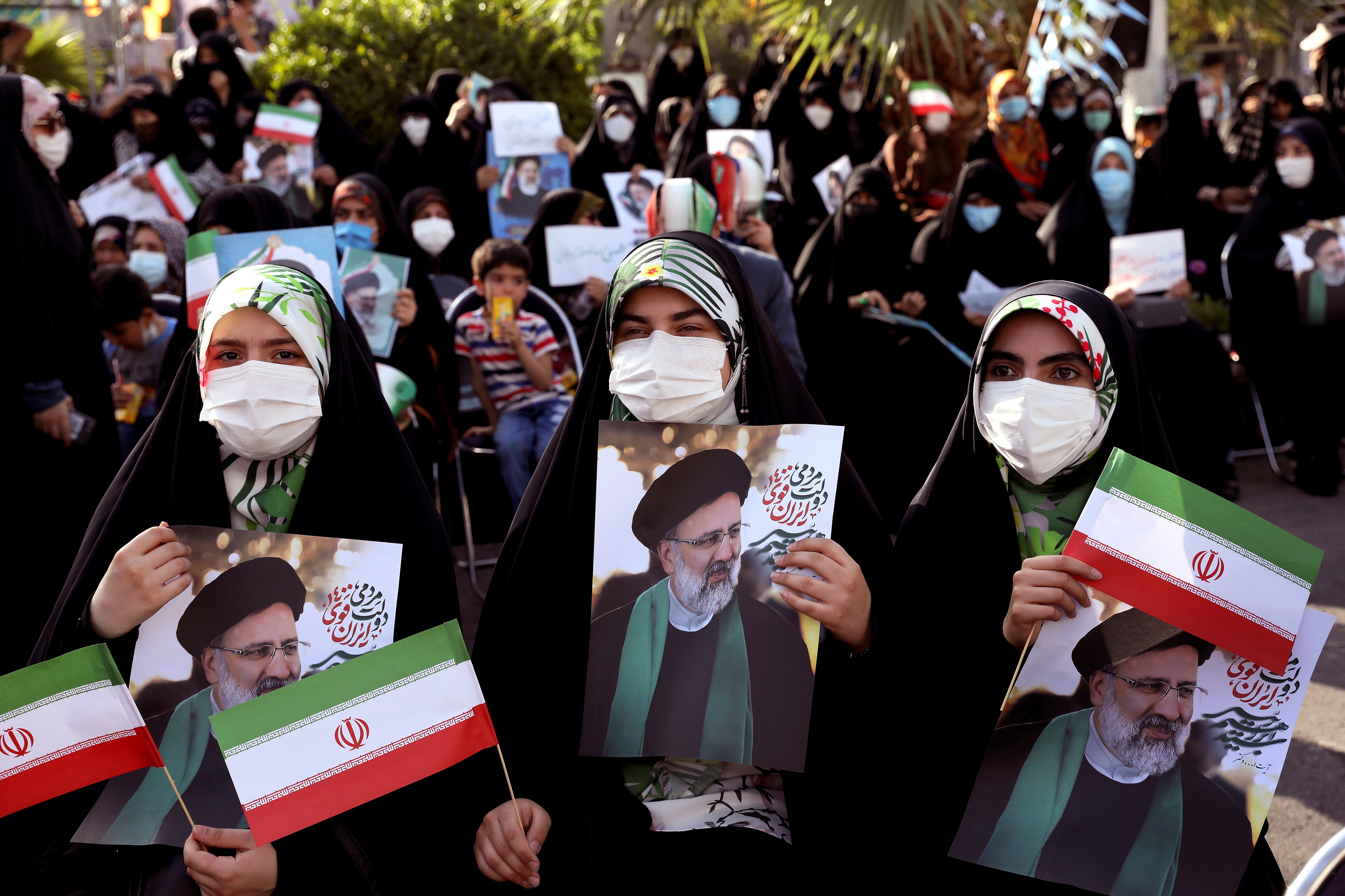 Supporters of presidential candidate Ebrahim Raisi during a rally in Tehran