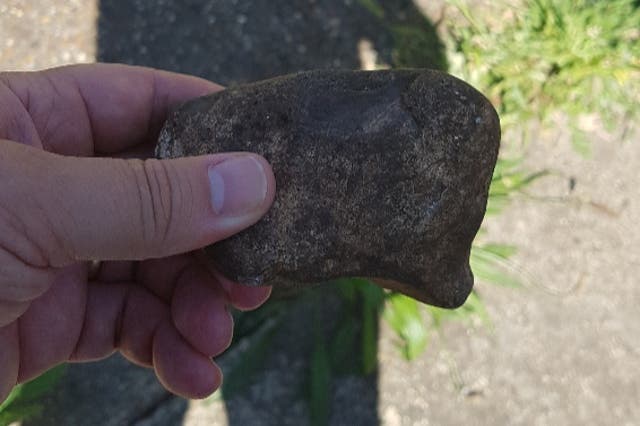 <p>A rock that was catapulted at police officers attending the scene in Stanwell Village, Surrey</p>