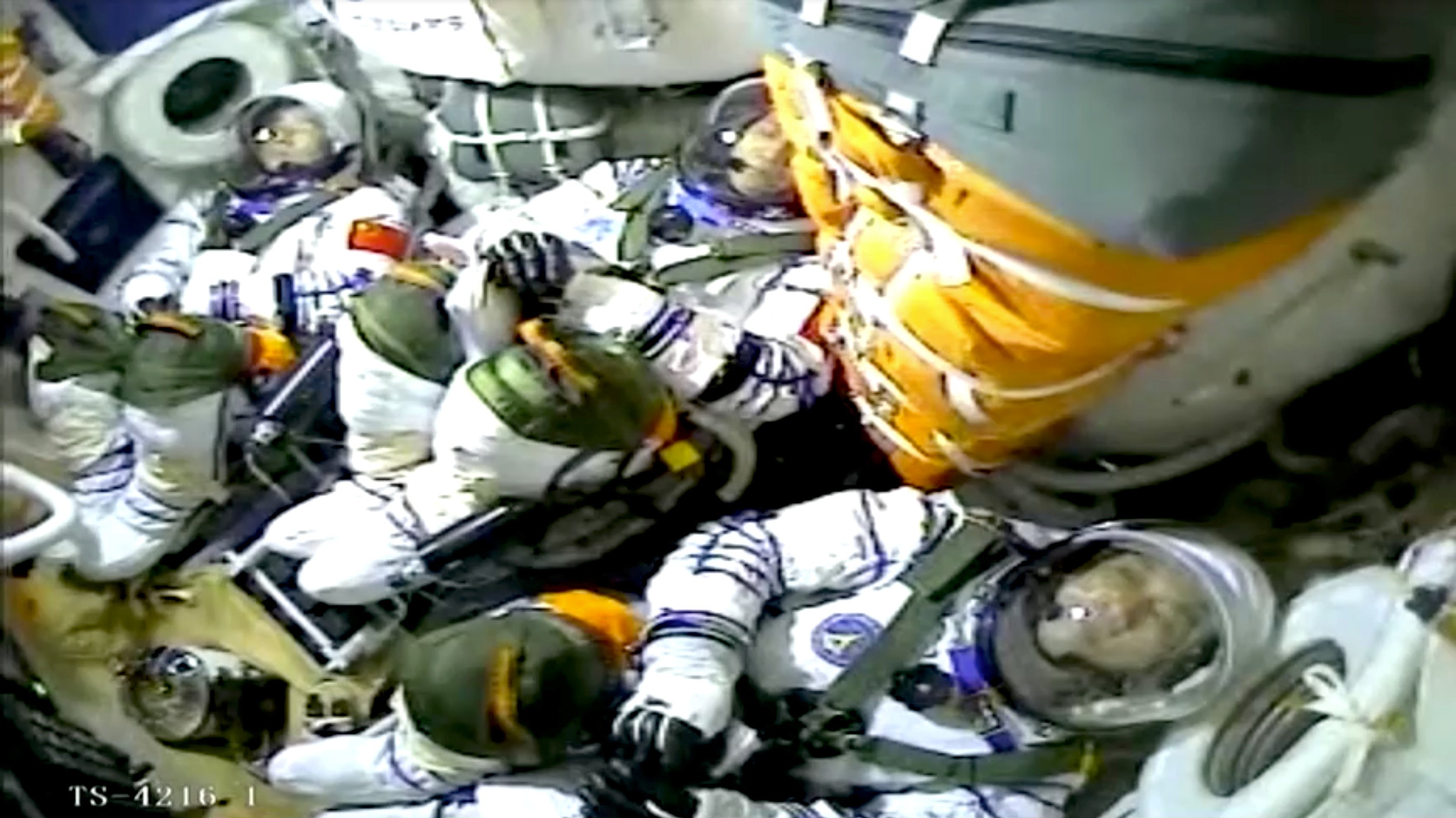 Chinese astronauts Nie Haisheng, Liu Boming, and Tang Hongbo are seen inside the Shenzhou-12 spacecraft