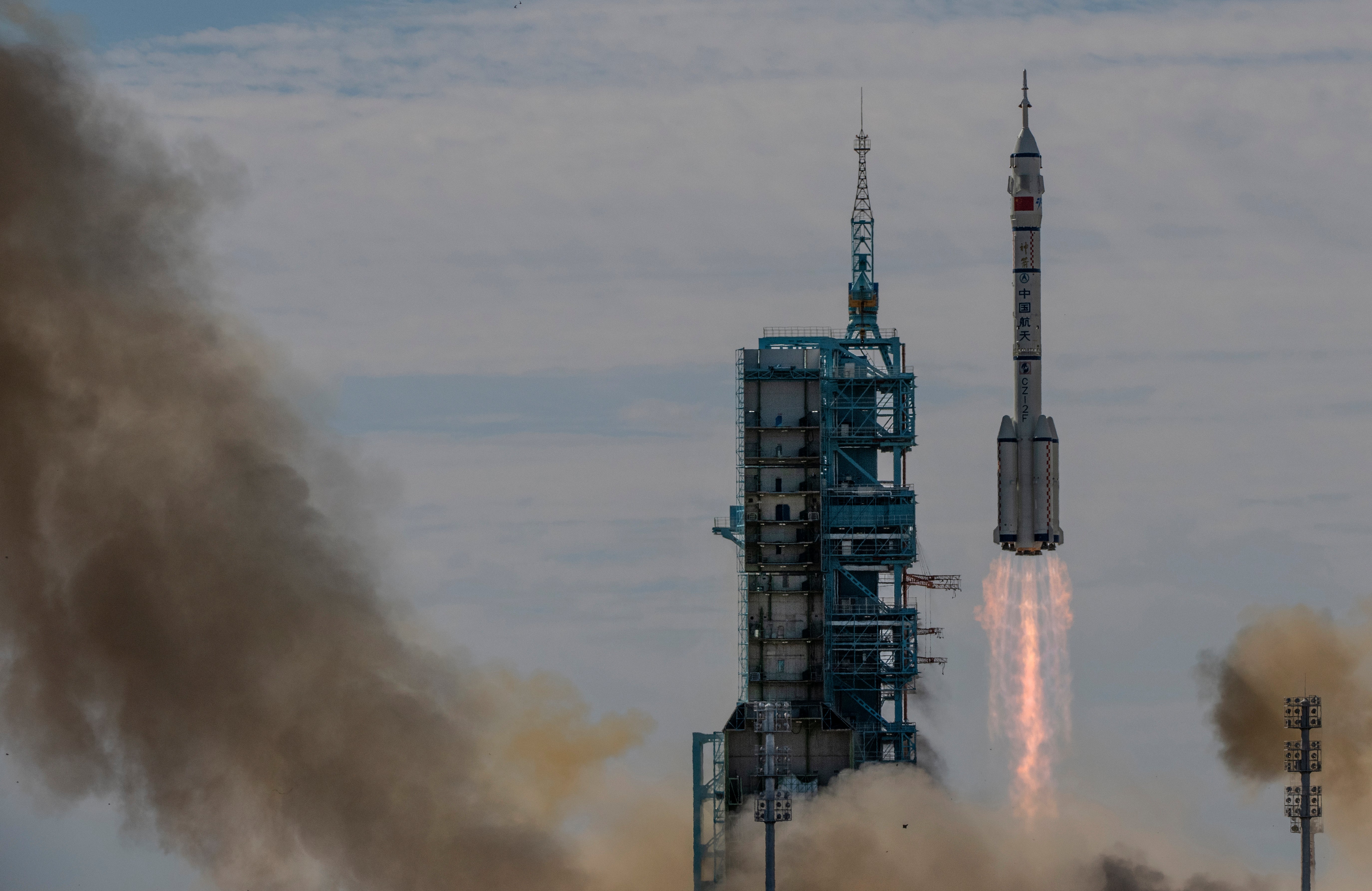 The manned Shenzhou-12 spacecraft from China's Manned Space Agency onboard the Long March-2F rocket launches with three Chinese astronauts onboard at the Jiuquan Satellite Launch Centre