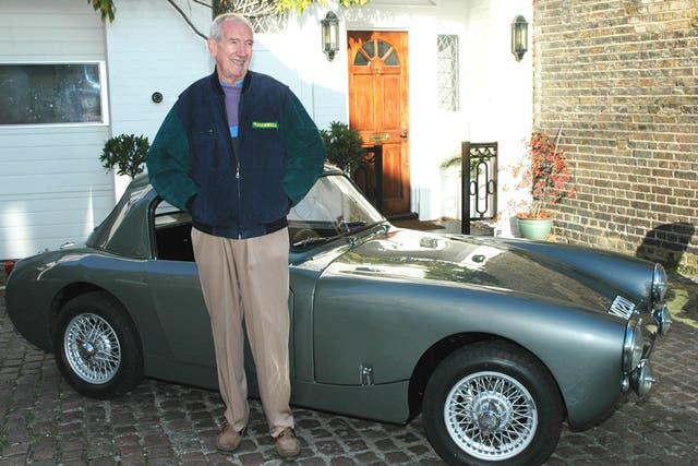 <p>Sprinzel, pictured with his most famous car</p>