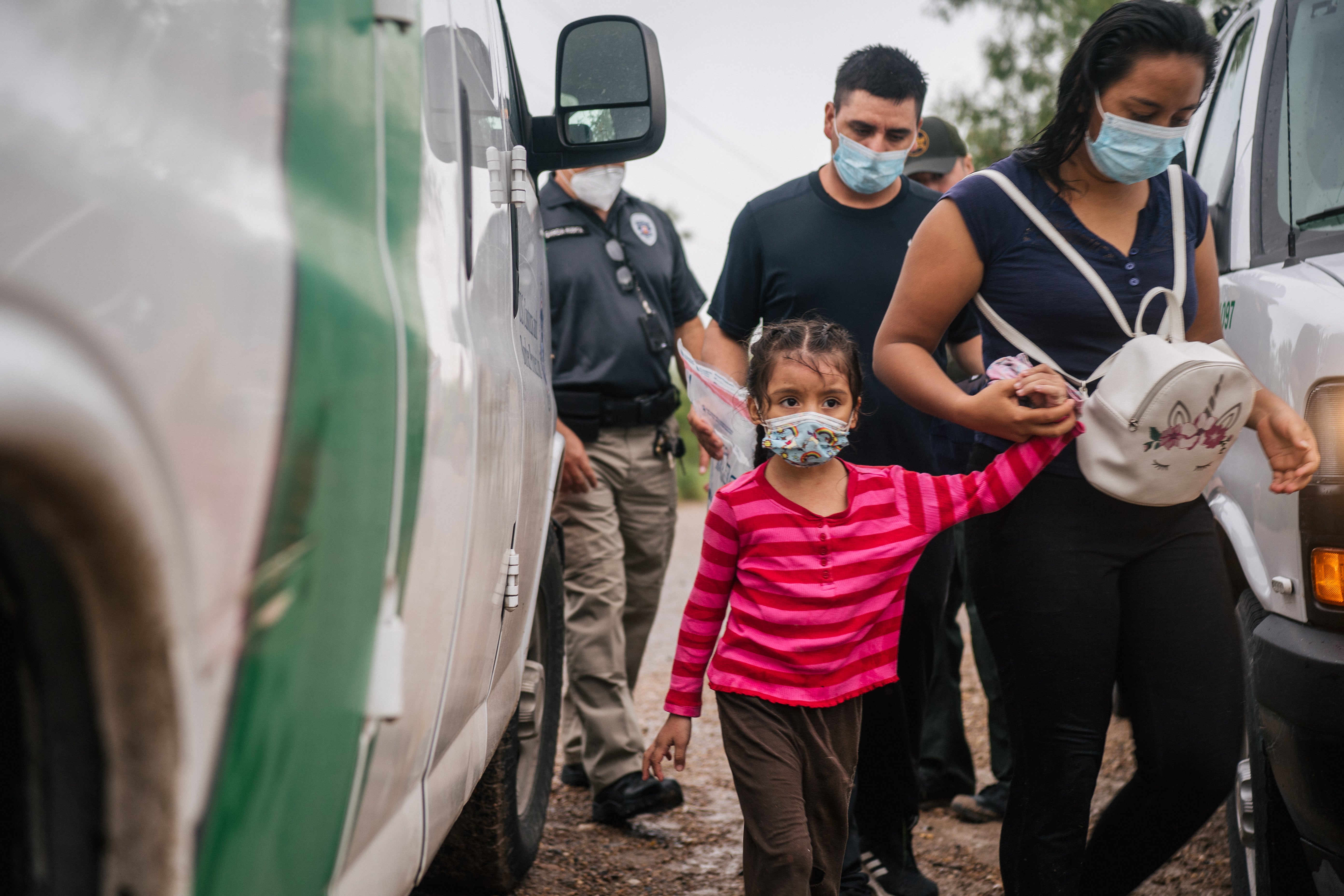 <p>An immigrant family seeking asylum prepare to be taken to a border patrol processing facility after crossing into the US on 16 June, 2021 in La Joya, Texas. US Attorney General Merrick Garland has reversed two Trump-era asylum decisions.</p>