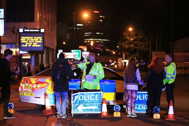 <p>Police at the Manchester Arena in May 2017 after the deadly suicide attack, which killed 22 people</p>