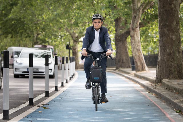 <p>Mayor of London Sadiq Khan cycles down a new Streetspace bike lane in London on 23 July 2020 </p>