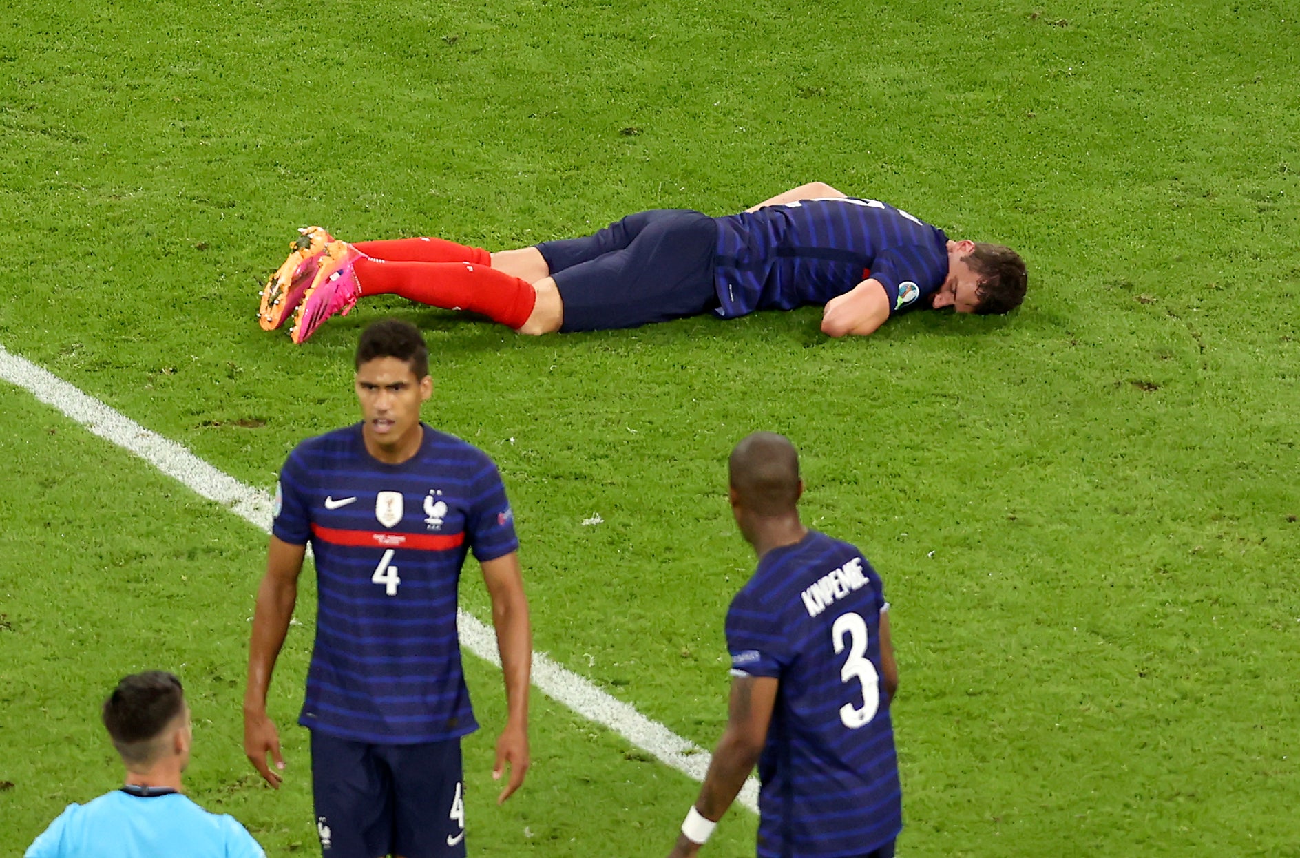 French medical officials say Benjamin Pavard, top, did not lose consciousness or suffer a concussion after his collision with Germany's Robin Gosens on Tuesday