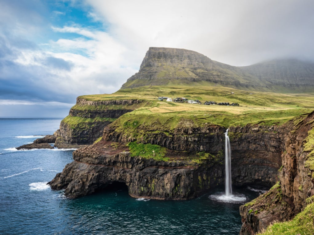 Visit the Mulafossur waterfall on the Faroe Islands this summer
