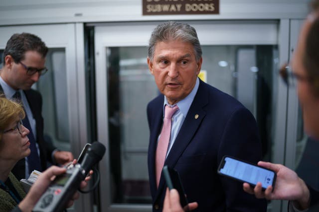 <p>Sen Joe Manchin speaks to reporters</p>