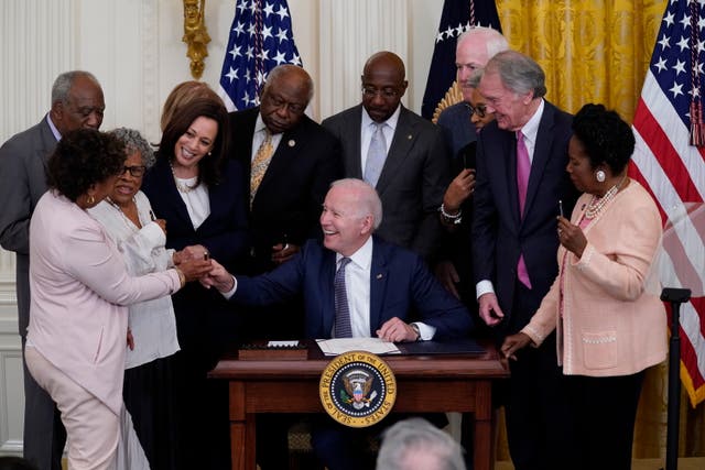 <p>President Joe Biden hands a pen to Rep Barbara Lee, D-Calif, after signing the Juneteenth National Independence Day Act, in the East Room of the White House on Thursday</p>