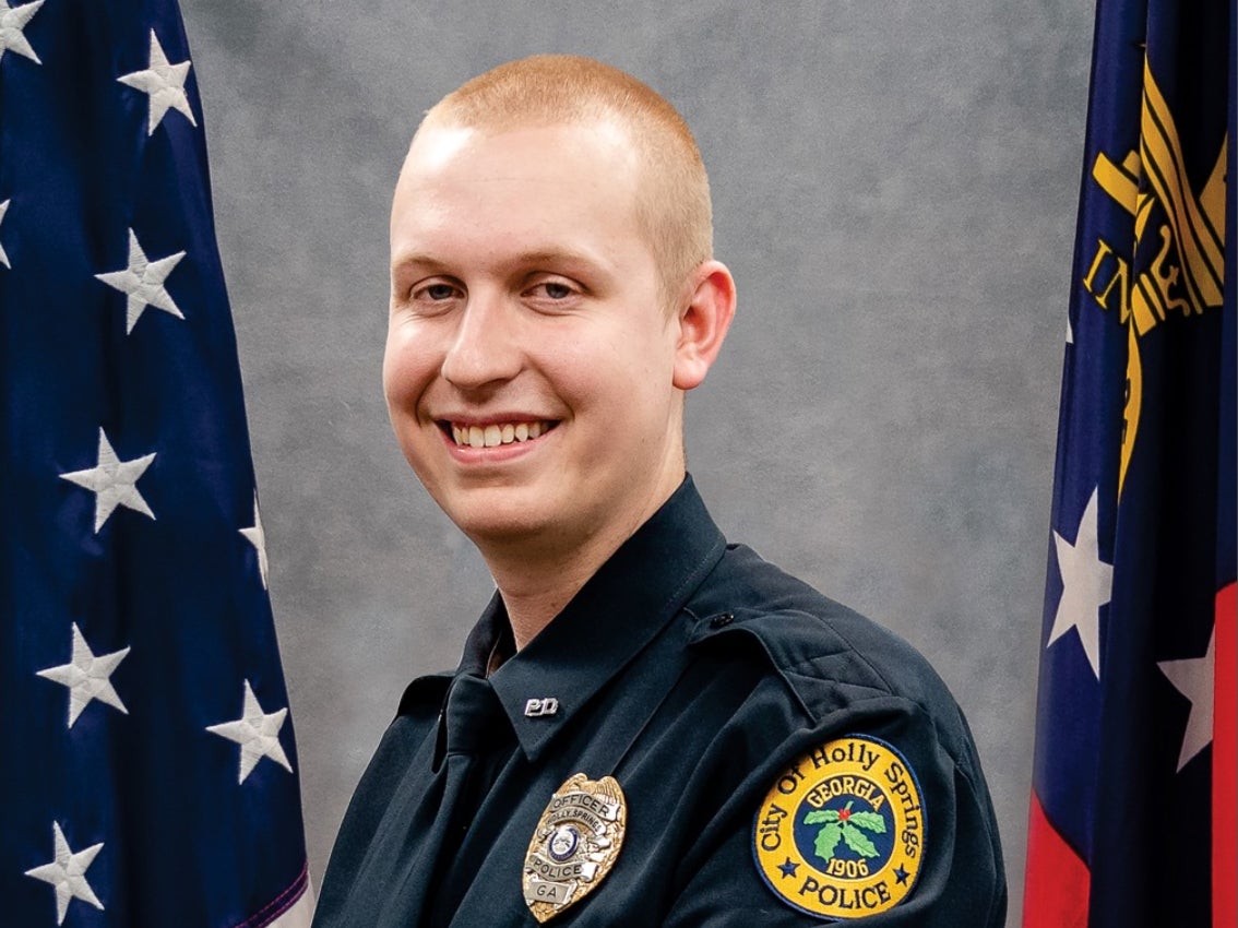 Police officer Joe Burson died during a traffic stop in Holly Springs, about 35 miles north of Atlanta