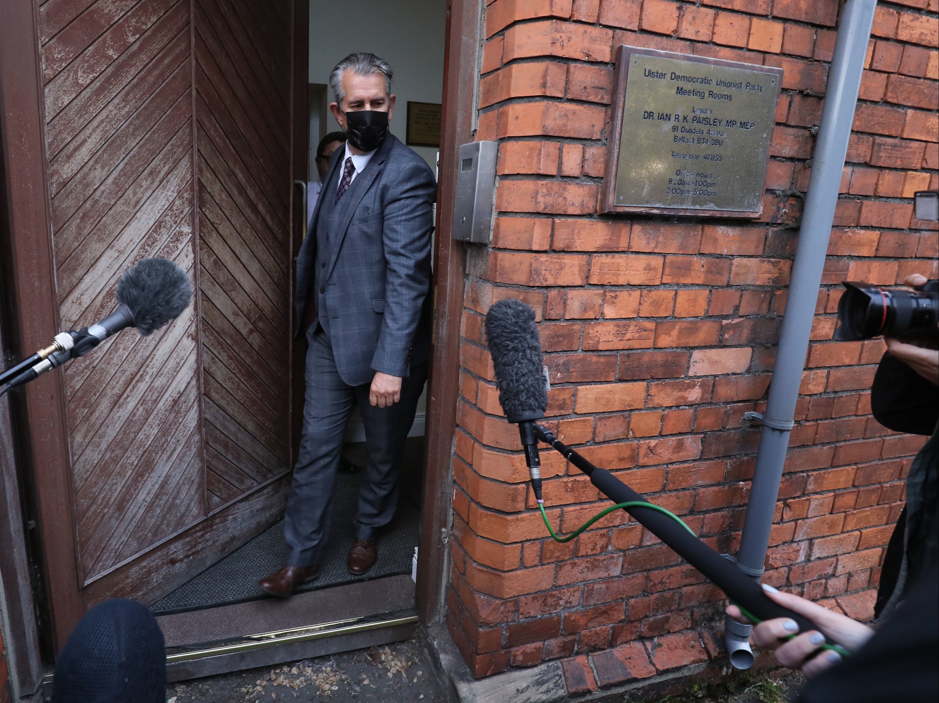 Edwin Poots leaves the DUP headquarters in Belfast on Thursday, prior to standing down as the party leader following an internal party revolt against him