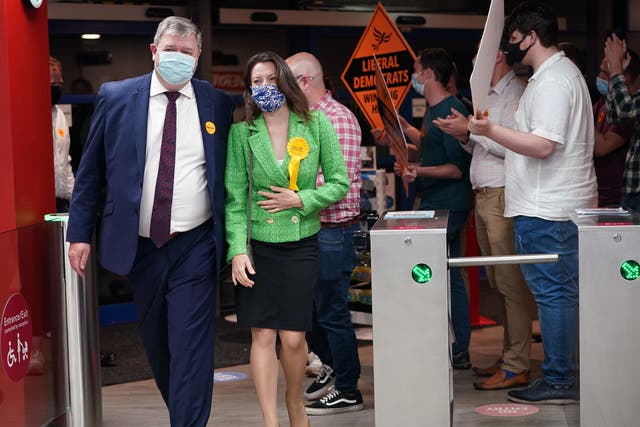 <p>Liberal Democrat candidate Sarah Green and Alistair Carmichael, Liberal Democrat MP for Orkney and Shetland, are greeted by party supporters upon arriving for the declaration</p>